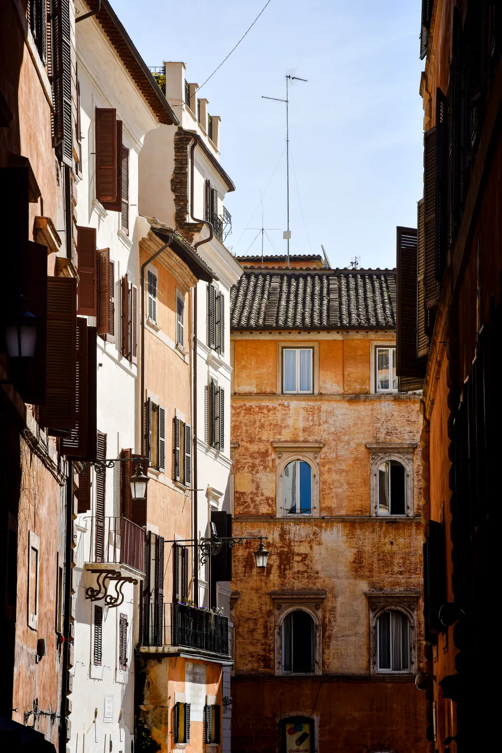 A quiet cobblestone backstreet in Rome's Trastevere neighbourhood