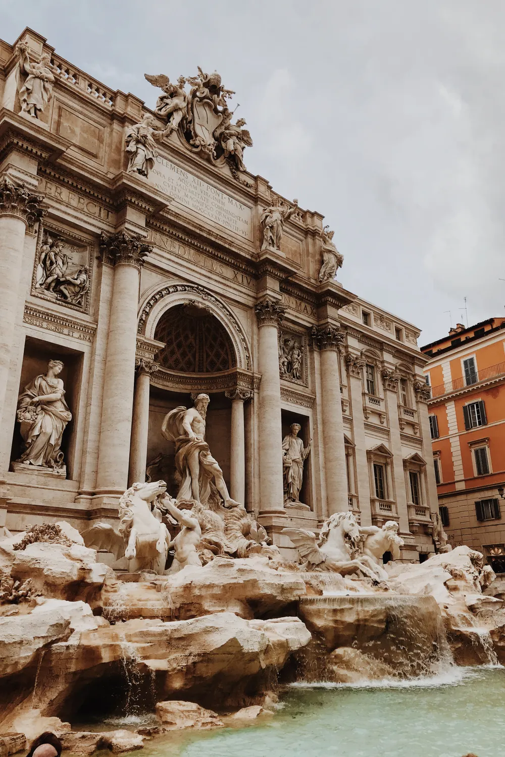 The Trevi Fountain in Rome, lit and almost empty in the early morning