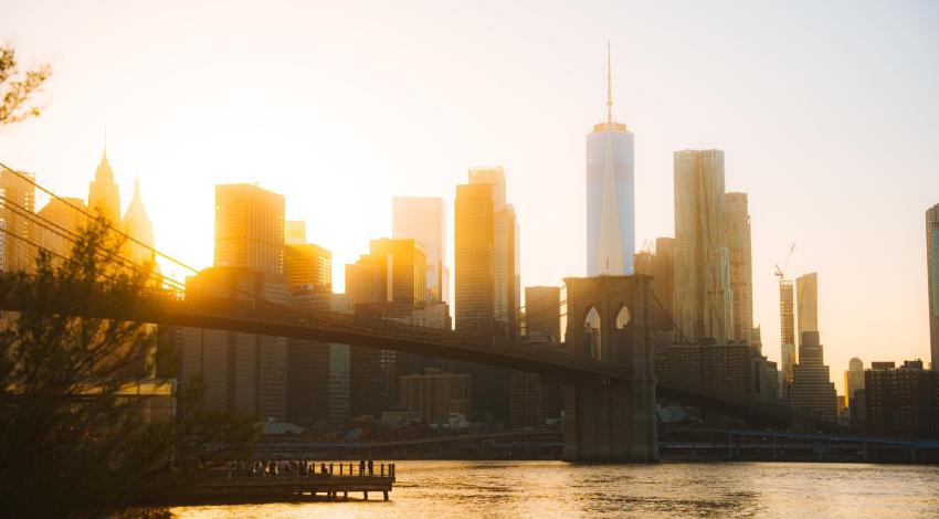 The Manhattan skyline and Brooklyn Bridge at golden hour
