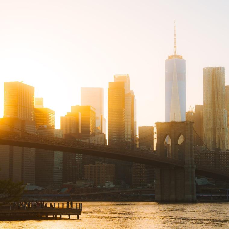 The Manhattan skyline and Brooklyn Bridge at golden hour