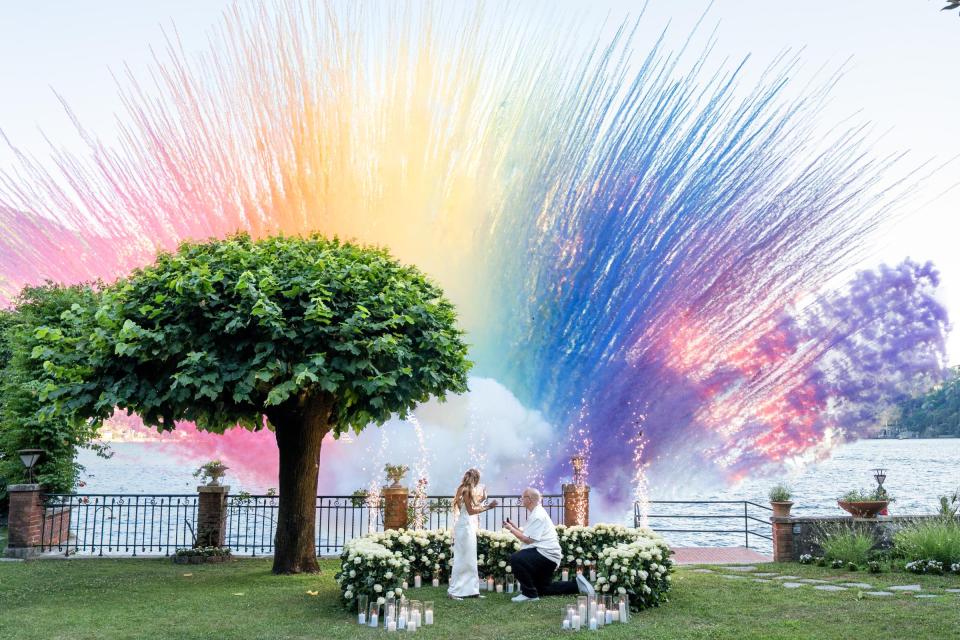 Spectacular Lake Como marriage proposal with colorful smoke effects and a romantic lakeside setup
