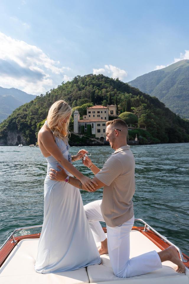 Romantic marriage proposal on a private boat overlooking Lake Como, Italy