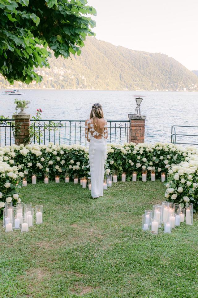 Romantic floral marriage proposal overlooking the water and mountains of Lake Como, Italy