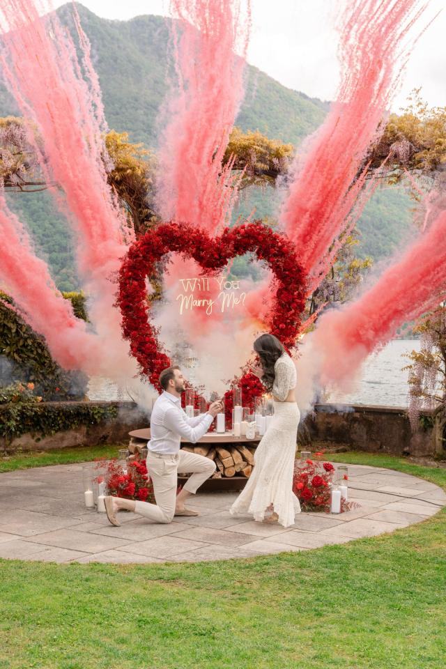 Luxury marriage proposal setup with pink flowers and heart-shaped floral decoration in Italy