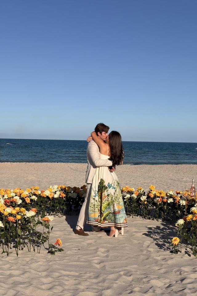 Couple embracing inside an elegant floral circle on Miami Beach